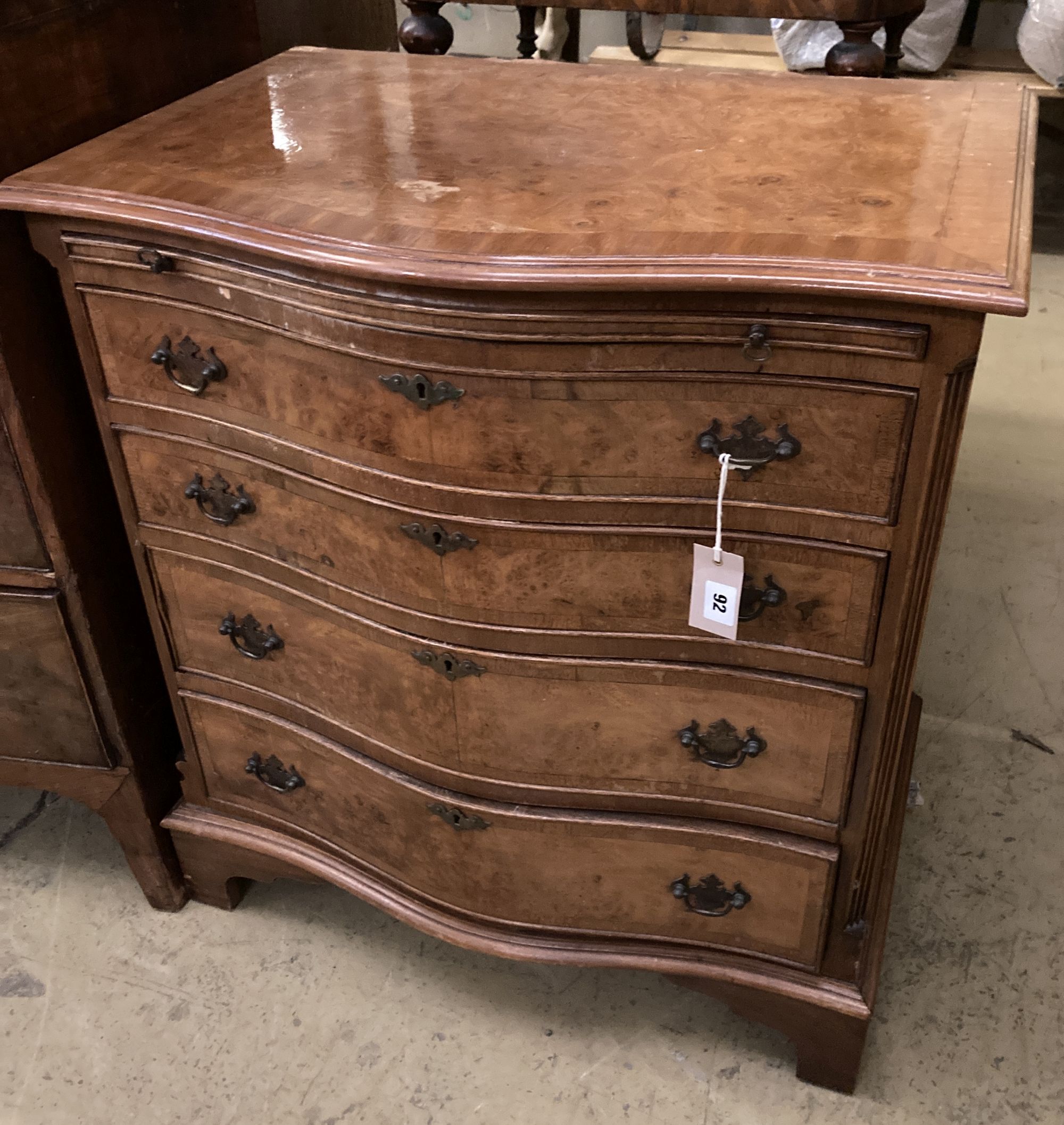 A George III style serpentine fronted, banded walnut chest, fitted four long drawers, width 70cm, depth 48cm, height 78cm